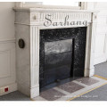 Indoor fireplace mantel with flutings in Carrara marble